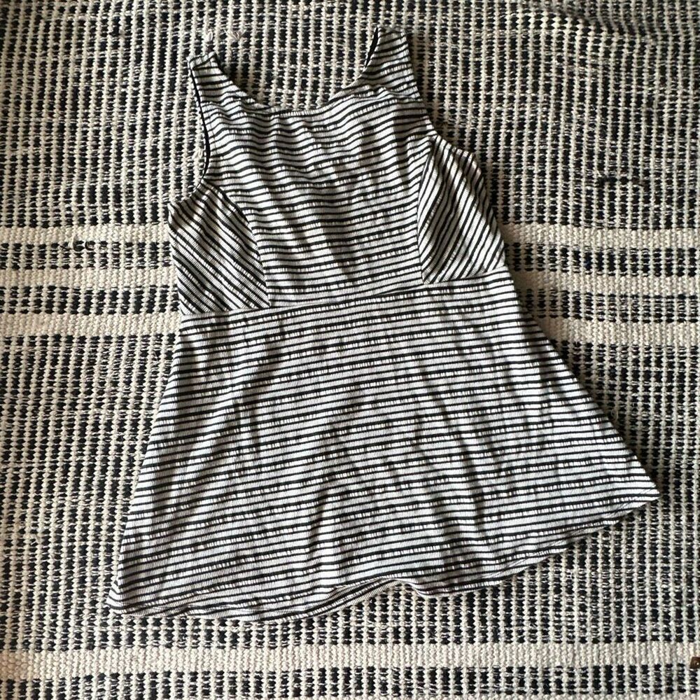 A pea in the pod Size small black and white striped blouse